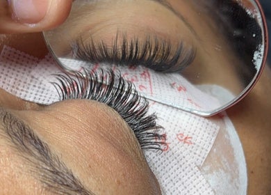 Eyelash extension application at The Hotspot, Longdenville, Chaguanas, TT, showcasing precision beauty care.