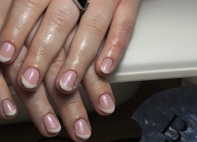 Freshly manicured nails at Bonnie Beauty, Bomaderry, New South Wales, AU with a glossy French tip design.