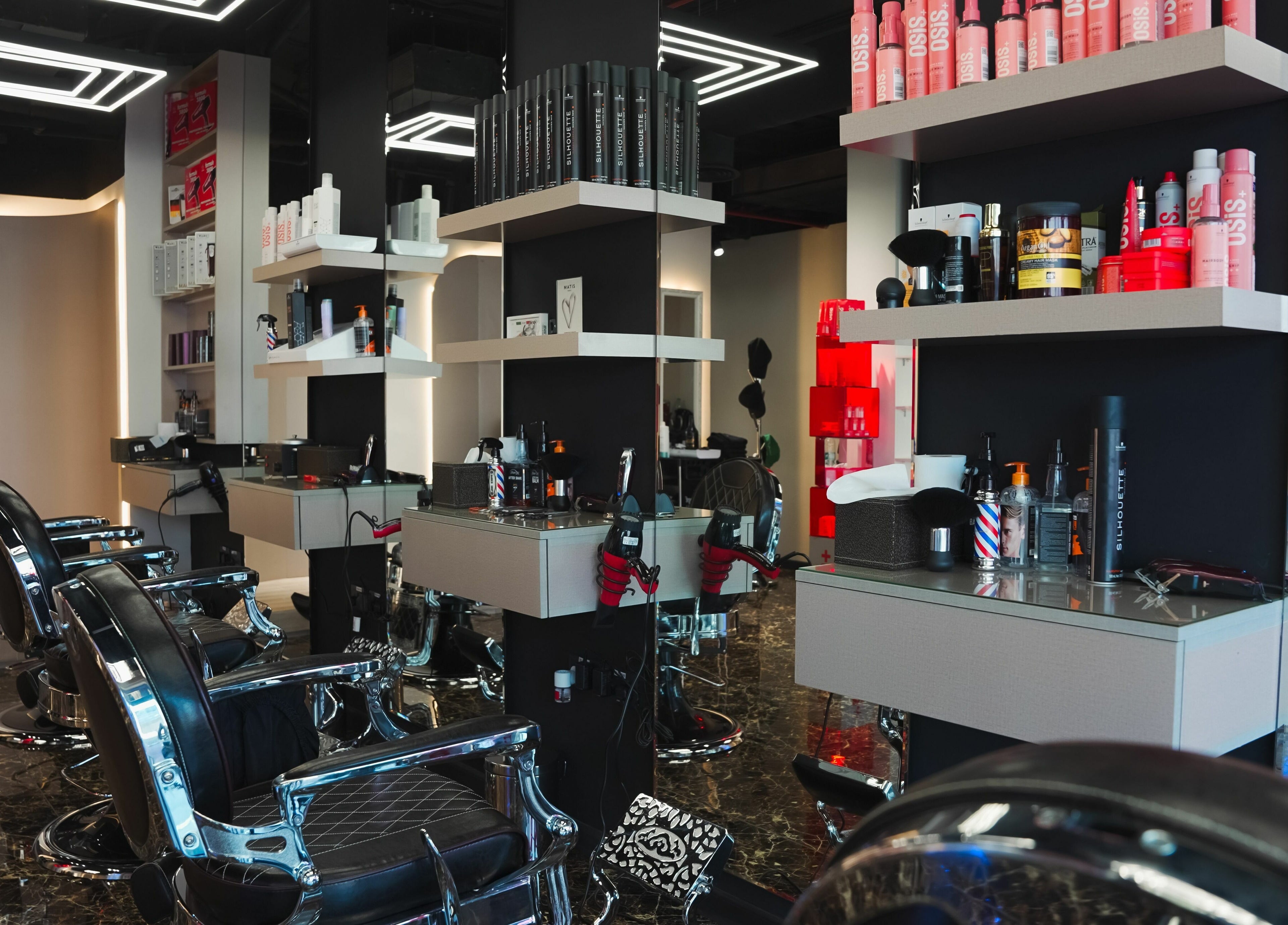 Elegant interior of Picasso Touch Salon For Gents, Abu Dhabi, AE showcasing modern barber chairs and sleek design.
