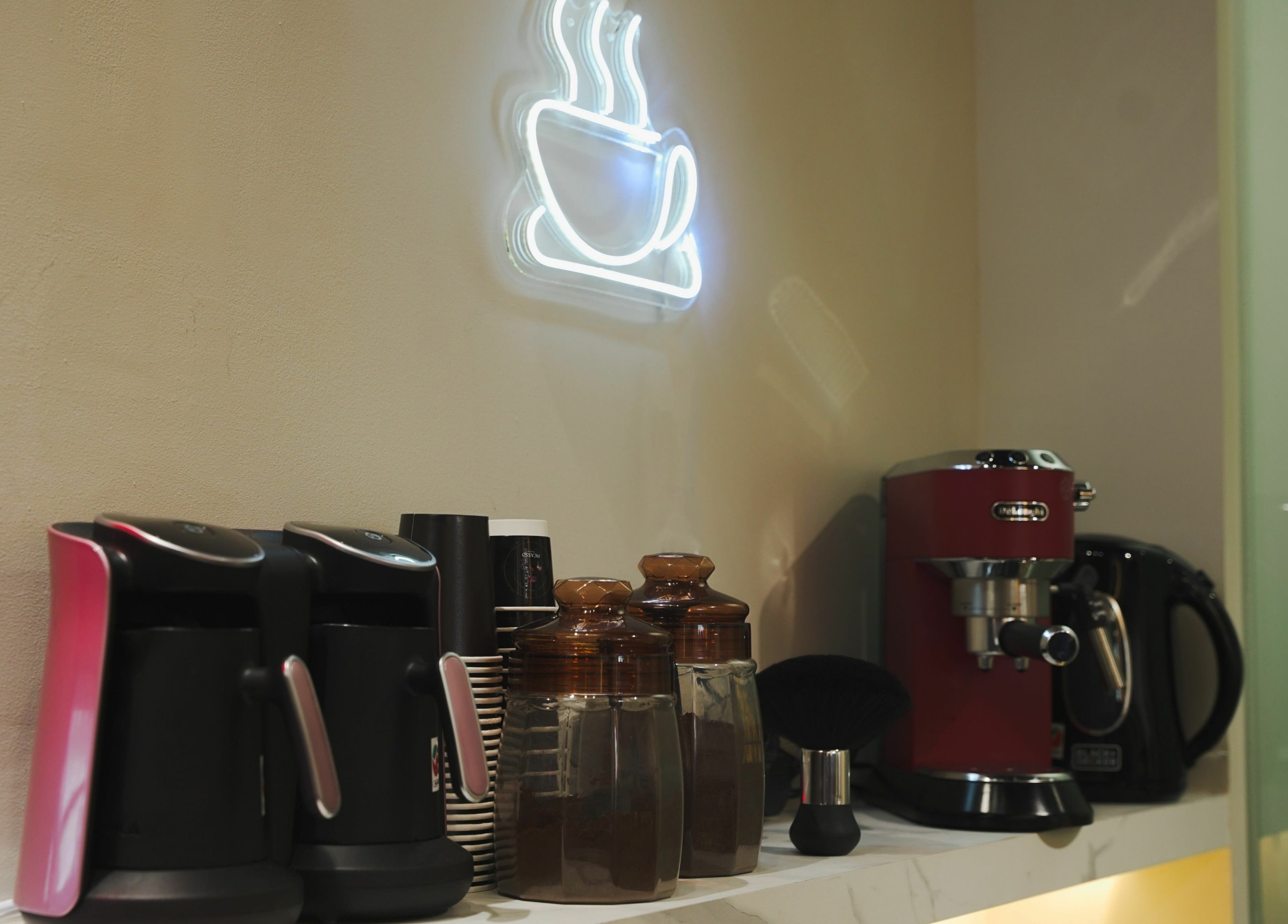 Cozy coffee station at Picasso Touch Salon For Gents, Abu Dhabi, AE, includes espresso machine and cups.