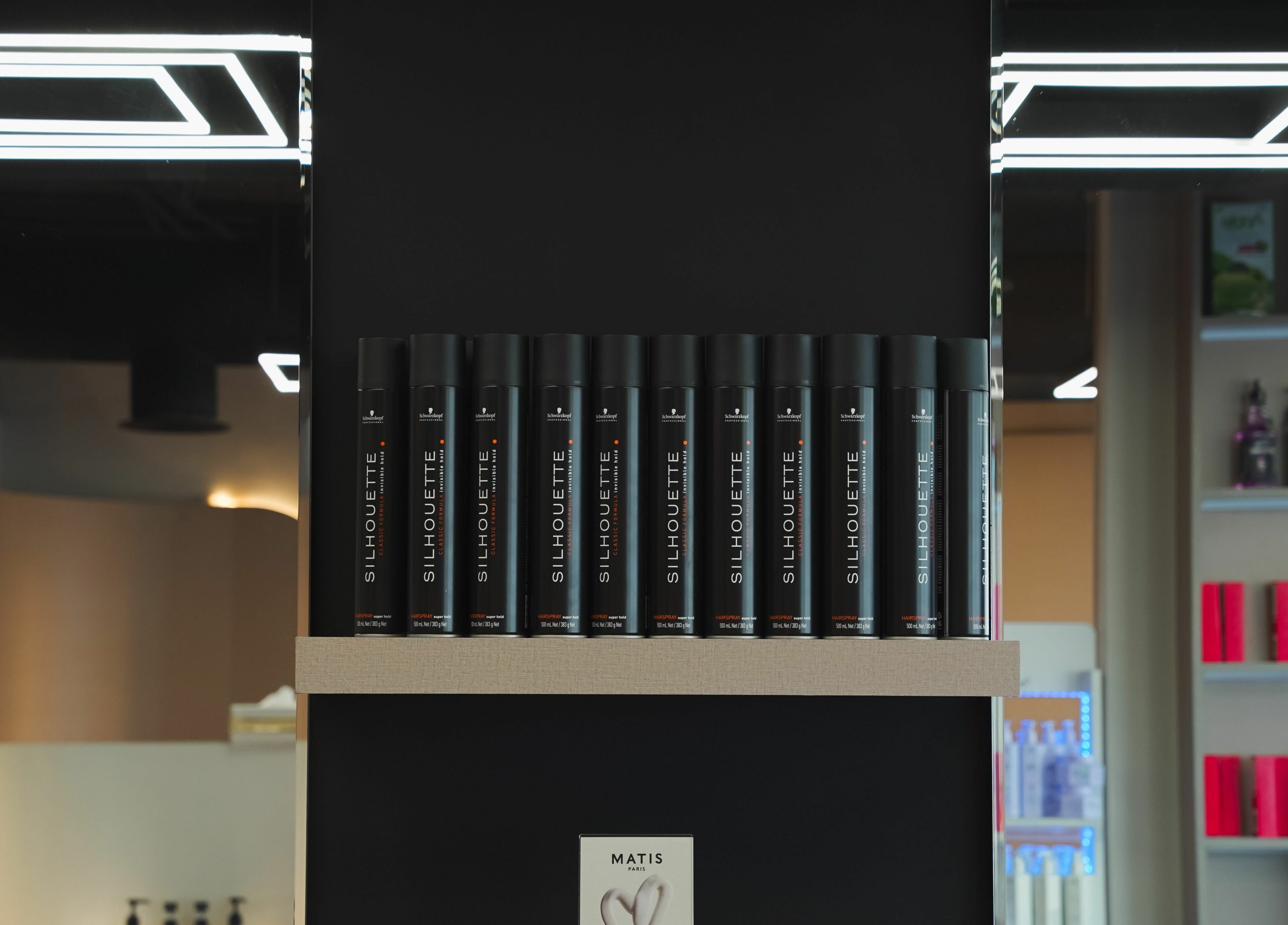 Stylish hair product display at Picasso Touch Salon For Gents in Abu Dhabi, AE highlighting premium brands.