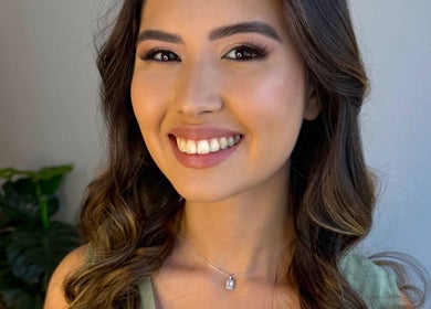 Smiling client with glowing makeup, serviced by Hahn Beauty - Mobile Service in Brighton-le-sands, New South Wales, AU.
