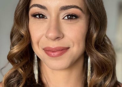 A radiant woman with styled hair, showcasing makeup by Hahn Beauty - Mobile Service, Brighton-le-sands, NSW, AU.