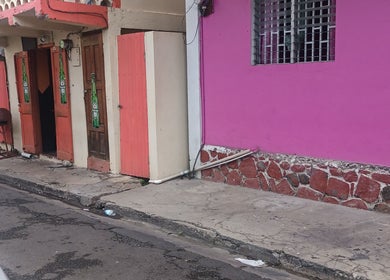 Colorful storefront near Merl's Beauty Section at Roseau, Saint George Parish, DM.