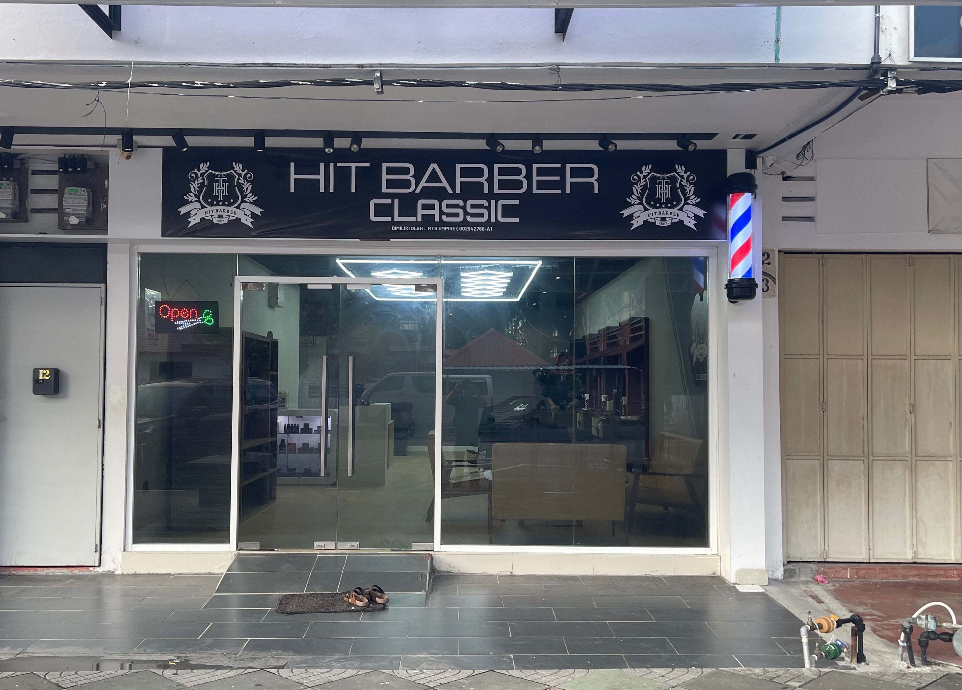 Exterior of Hit Barber Classic Langkawi, a stylish barbershop in Langkawi, Kedah, MY, with an inviting atmosphere.