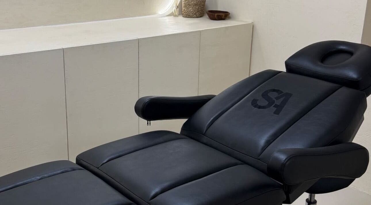 Luxurious treatment chair at Castle House Banstead, Banstead, England, GB, in a minimalist setting.