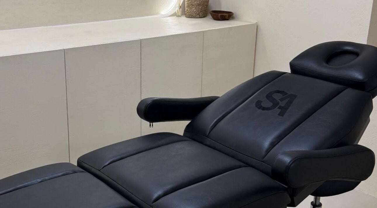 Luxurious treatment chair at Castle House Banstead, Banstead, England, GB, in a minimalist setting.