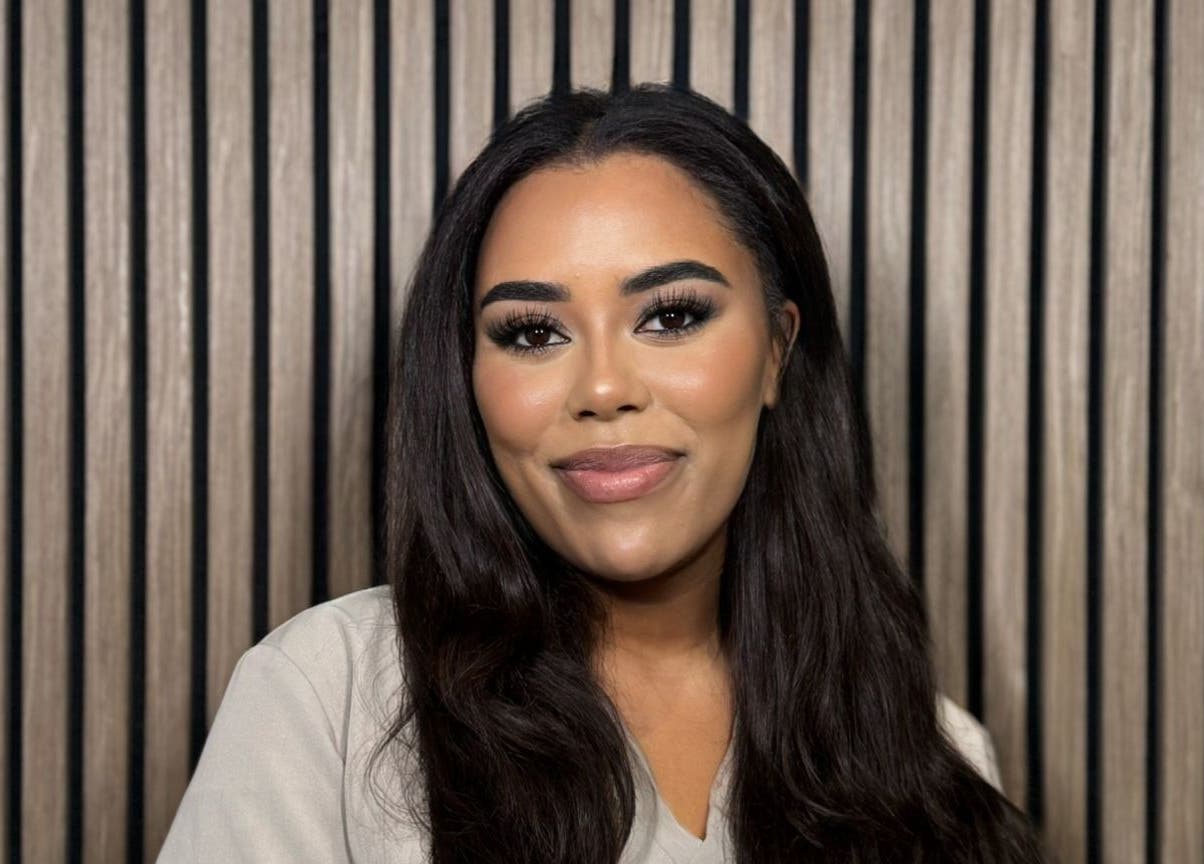 Smiling woman at India Brown Aesthetics & Beauty (CROYDON), Addiscombe, showcasing elegant makeup.