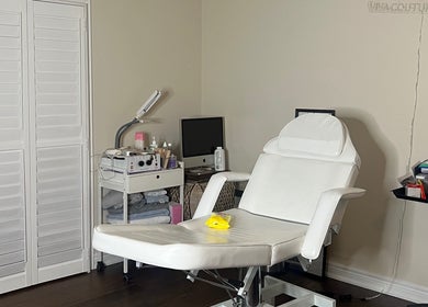 Luxury spa treatment room at Nyeyeview, Hamilton, Ontario, CA, featuring a comfortable white chair.