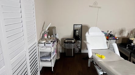 Relaxing treatment room at Nyeyeview, Hamilton, Ontario, CA with white chair and spa equipment.