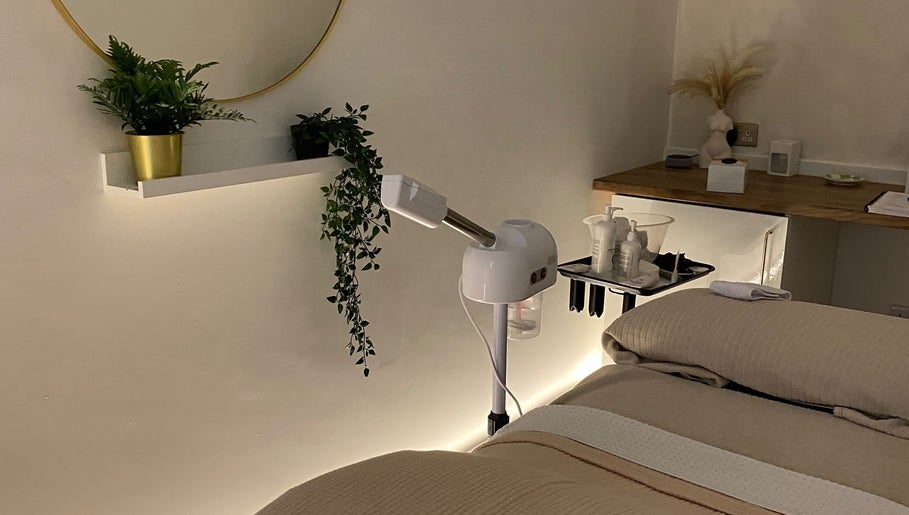 Calm treatment room at Hunt Skincare, Eastbourne, England, GB with plants and skincare equipment.