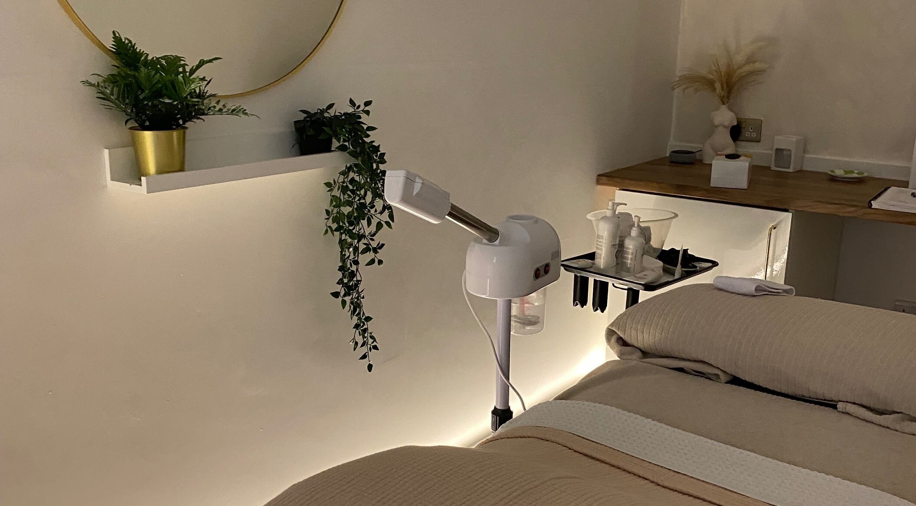Calm treatment room at Hunt Skincare, Eastbourne, England, GB with plants and skincare equipment.