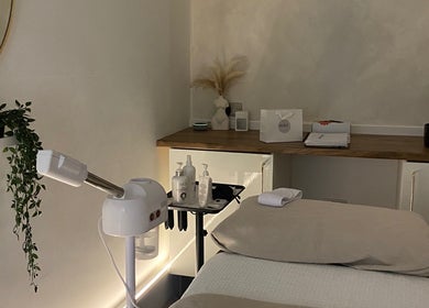 Cozy skincare room at Hunt. Skincare, Eastbourne, England, GB with treatment bed and calming decor.