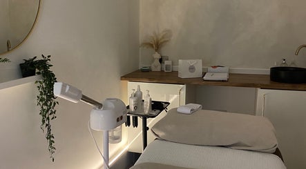 Cozy skincare room at Hunt. Skincare, Eastbourne, England, GB with treatment bed and calming decor.
