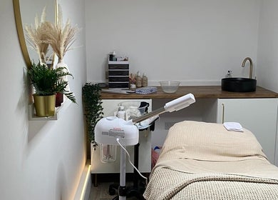 Calm and inviting treatment room at Hunt. Skincare, Eastbourne, England, GB with modern decor and spa bed.