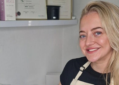 Smiling staff at Reform Skin Clinic, Cawood, England, showcasing certifications and products.