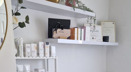 Product and certificate display at Reform Skin Clinic, Cawood, England, GB, showcasing elegant decor.