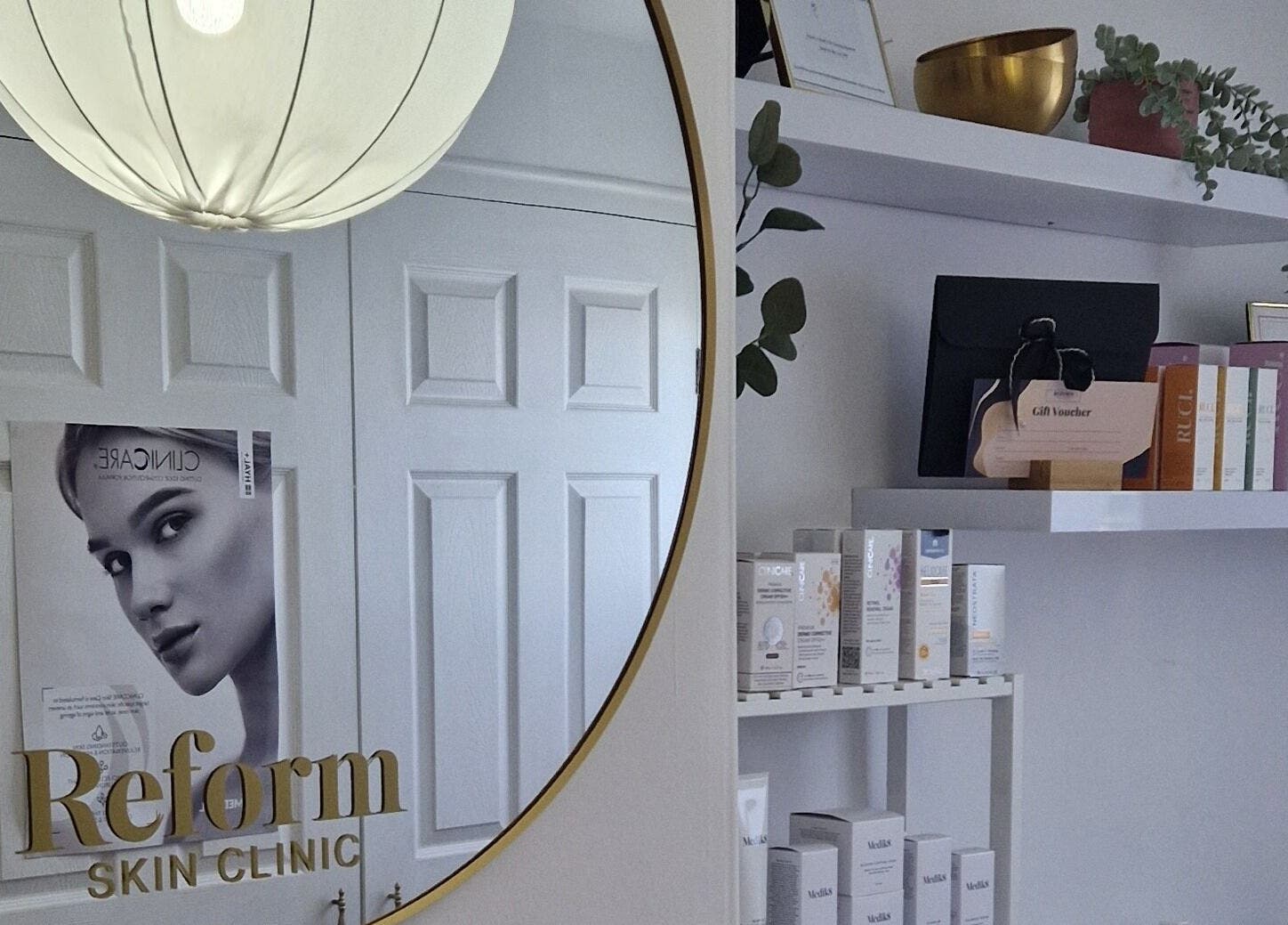 Elegant interior of Reform Skin Clinic in Cawood, England featuring mirror and product display.