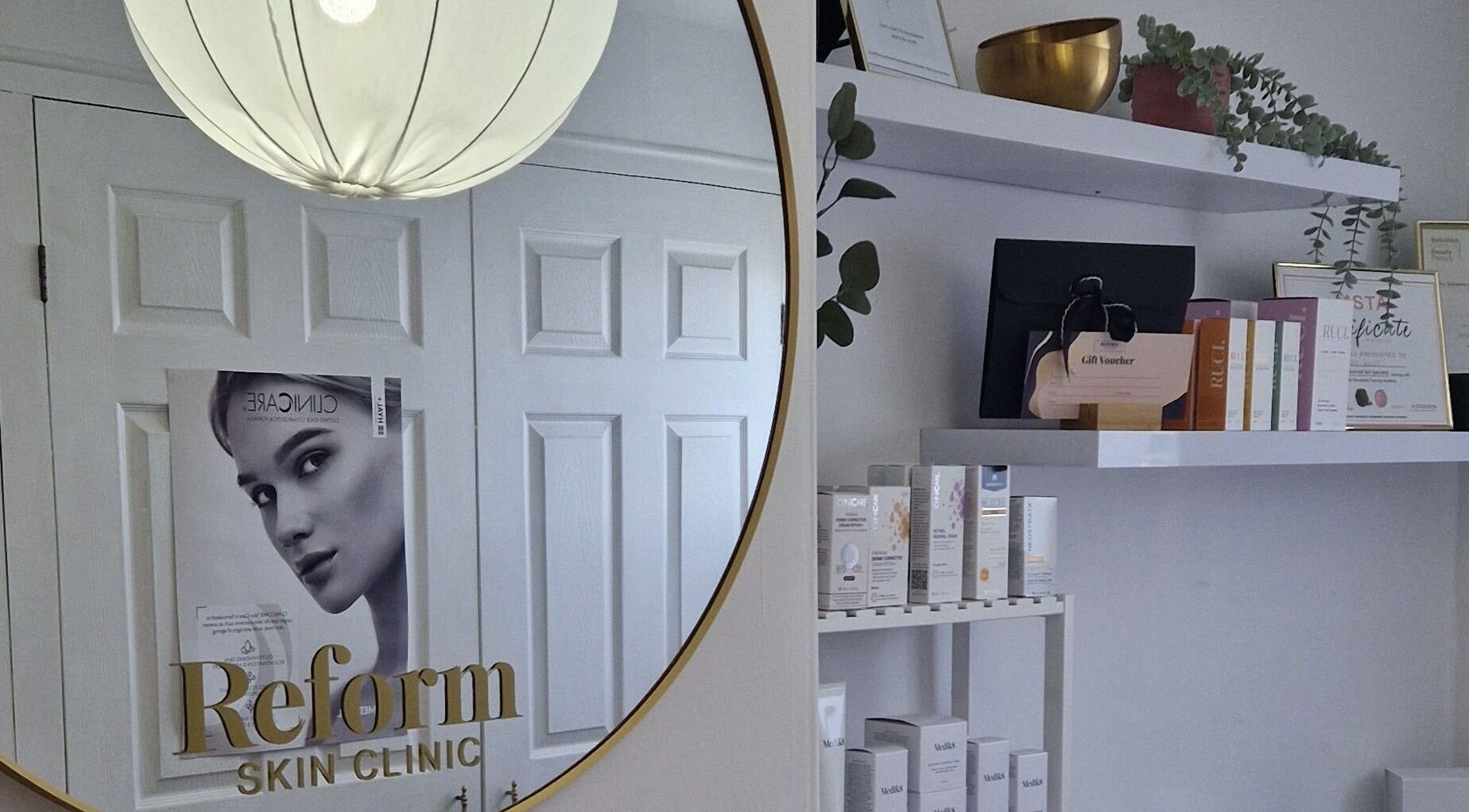 Elegant interior of Reform Skin Clinic in Cawood, England featuring mirror and product display.