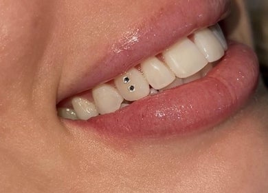 Close-up of a smile with tooth gems at Ever and Ivory - Teeth Whitening and Tooth Gems in Pimpama, Queensland, AU.