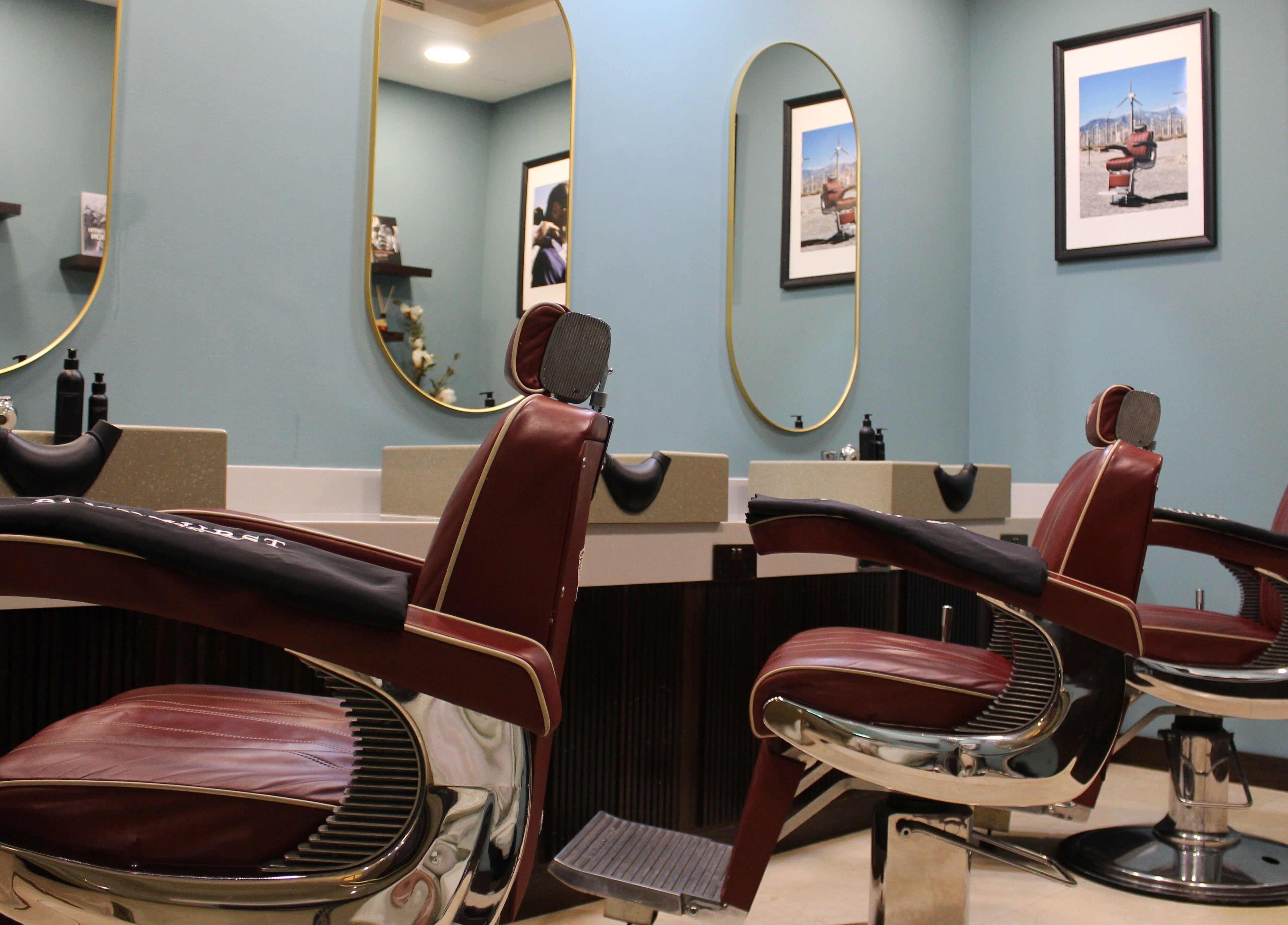 Luxurious barber chairs at Pankhurst London, Dubai, Dubai, AE offering premium grooming services.