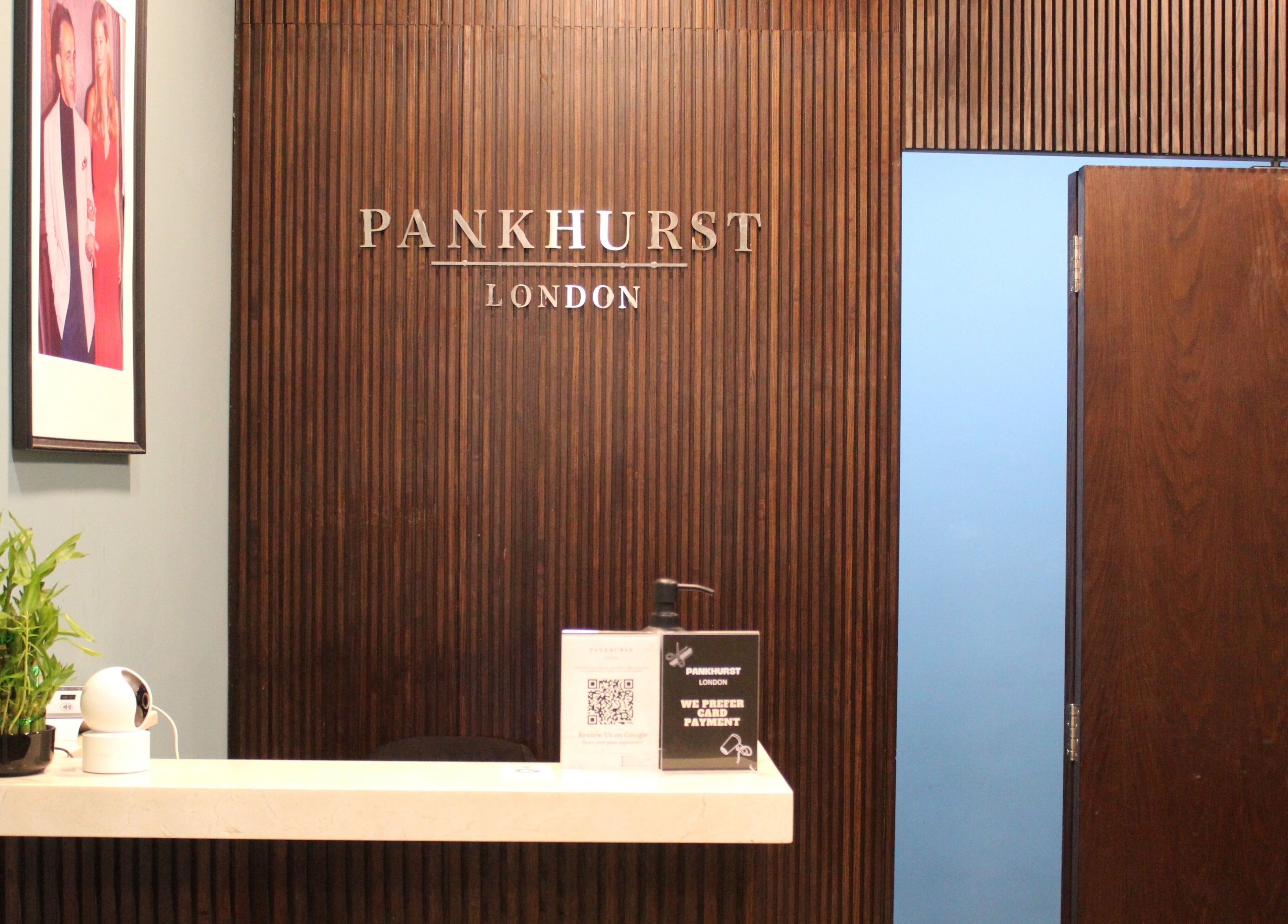 Elegant reception at Pankhurst London, Dubai, Dubai, AE with wooden decor and greenery.