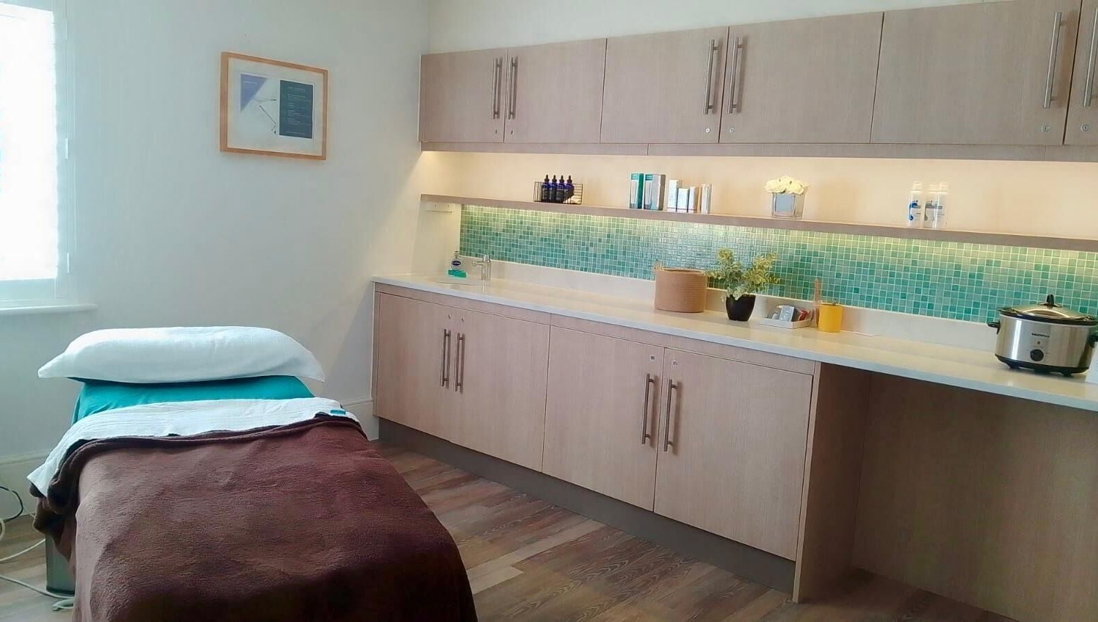 Peaceful spa treatment room at Gifford Lea, Chester, England, GB, with massage table and calming decor.