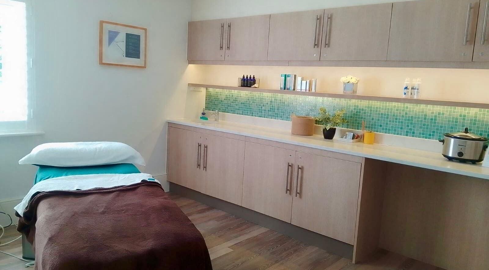 Peaceful spa treatment room at Gifford Lea, Chester, England, GB, with massage table and calming decor.