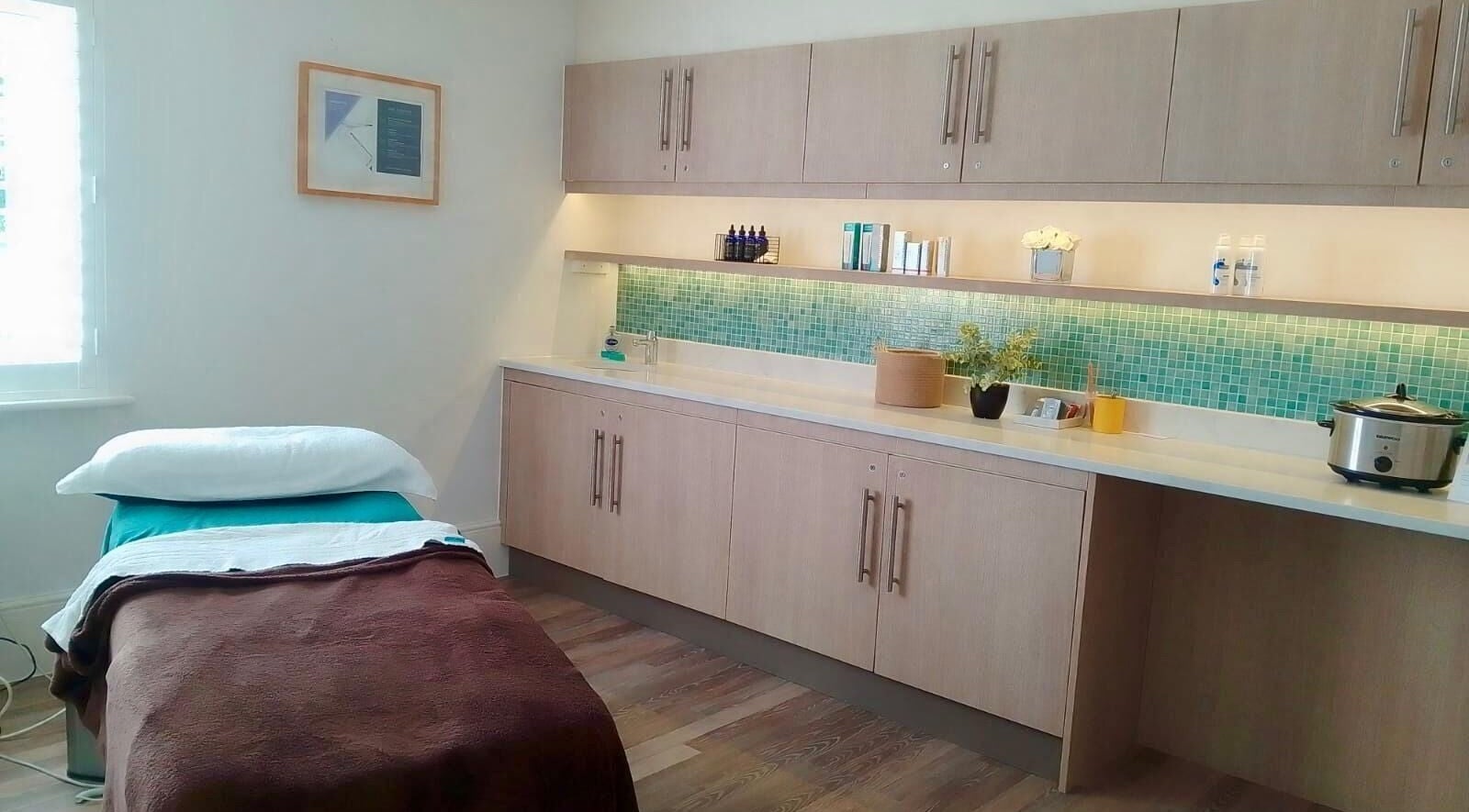 Peaceful spa treatment room at Gifford Lea, Chester, England, GB, with massage table and calming decor.