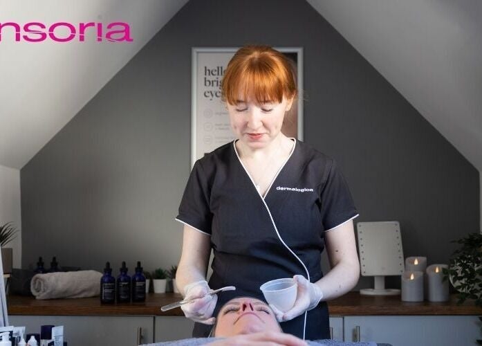 Therapist performing a facial treatment at Gifford Lea, Chester, England, GB in a tranquil room.
