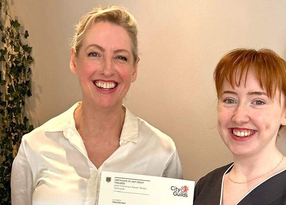Two smiling women at Gifford Lea in Chester, England, GB celebrate beauty therapy certification.