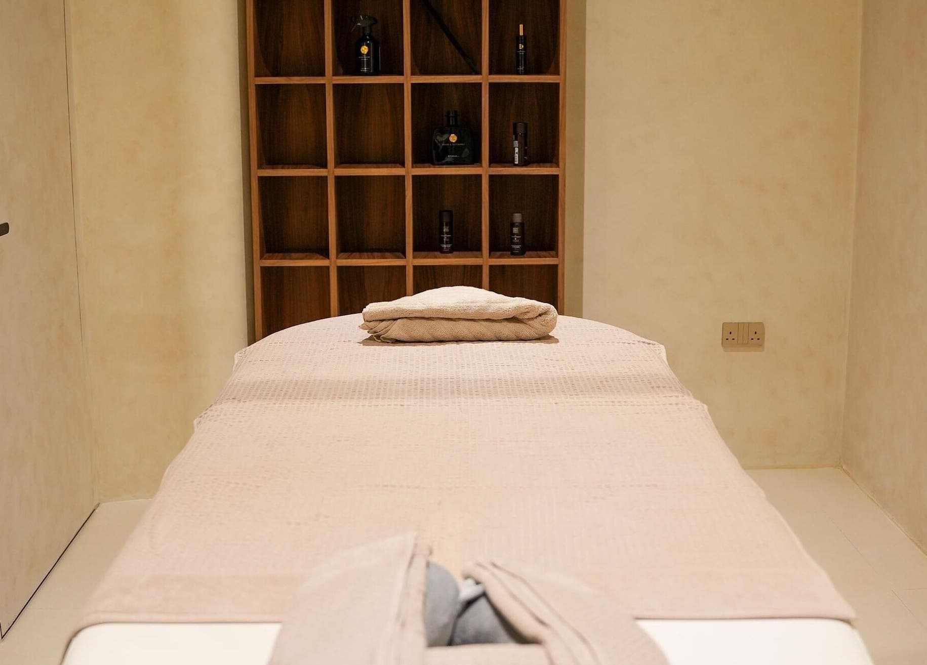 Serene treatment room at Calma Massage & Spa, Al-seef, Bahrain, BH, featuring a cozy massage table.