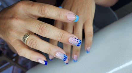 Stylish blue dotted nail art at Flamingo Beauty House, Cape Town, Western Cape, ZA.