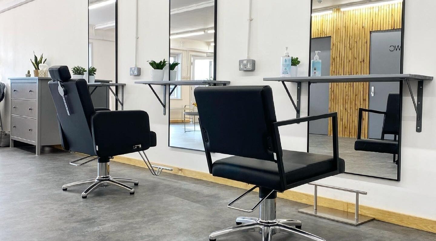 Modern salon chairs and mirrors at Rebecca Claire salon in Worcester, England, GB.