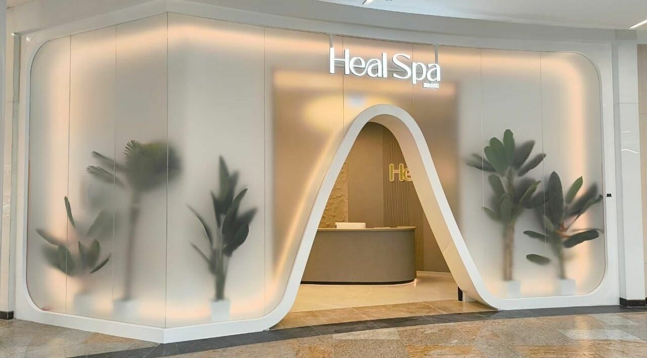 Elegant entrance of Heal Spa Best Massage at Dubai Festival City Mall, Dubai, Dubai, AE with plants and soft lighting.