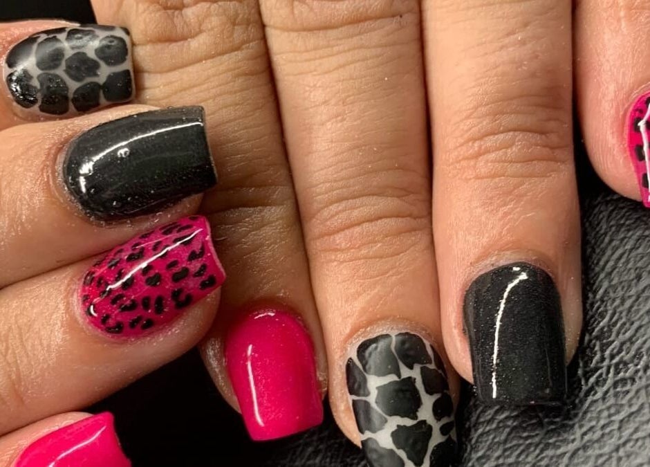 Stylish leopard print manicure at NDC Nails, Golden Square, Victoria, AU showcasing bold pink and black designs.