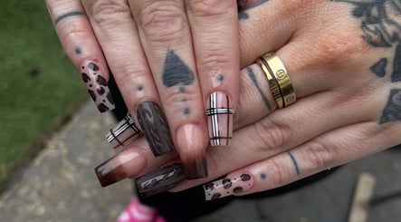 Stylish nail art at Alyssia-Ellen's Beauty, Bordon, England, GB, featuring creative brown and plaid designs.