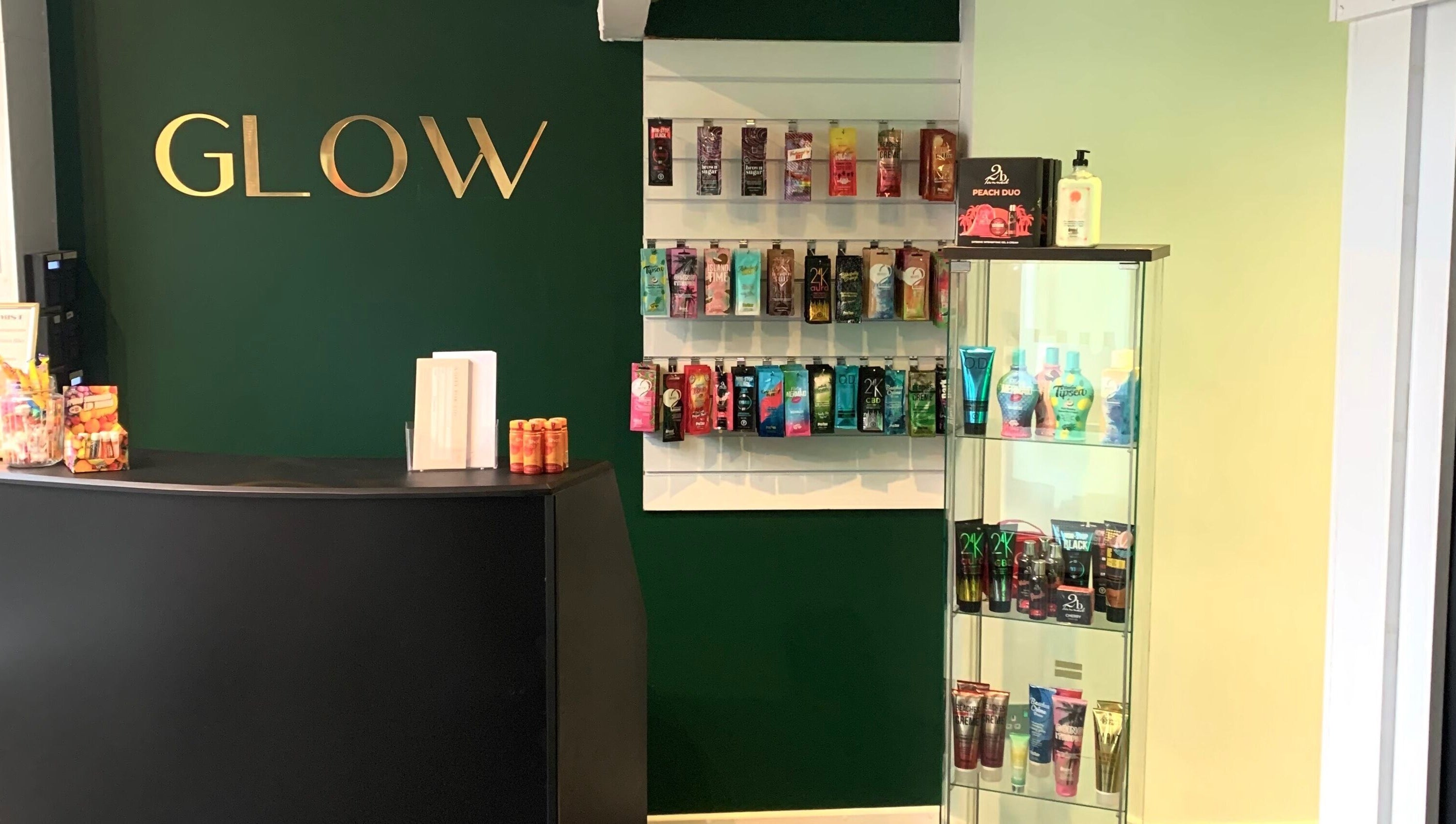 Welcome area at Glow Tanning and Beauty, Chelmsford, England, GB, showcasing tanning products.