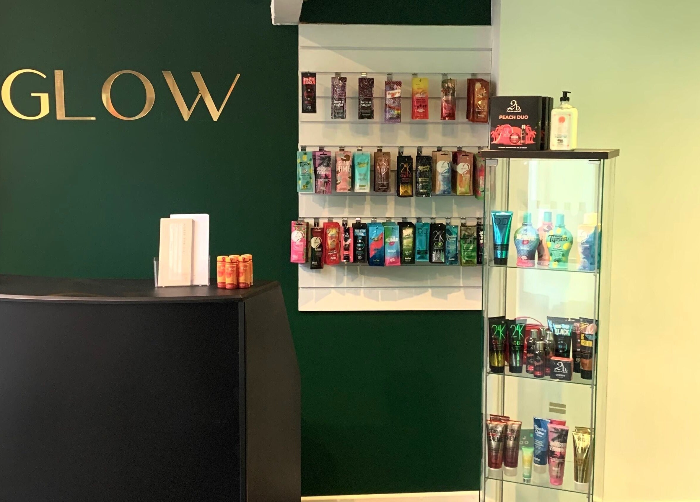 Welcome area at Glow Tanning and Beauty, Chelmsford, England, GB, showcasing tanning products.