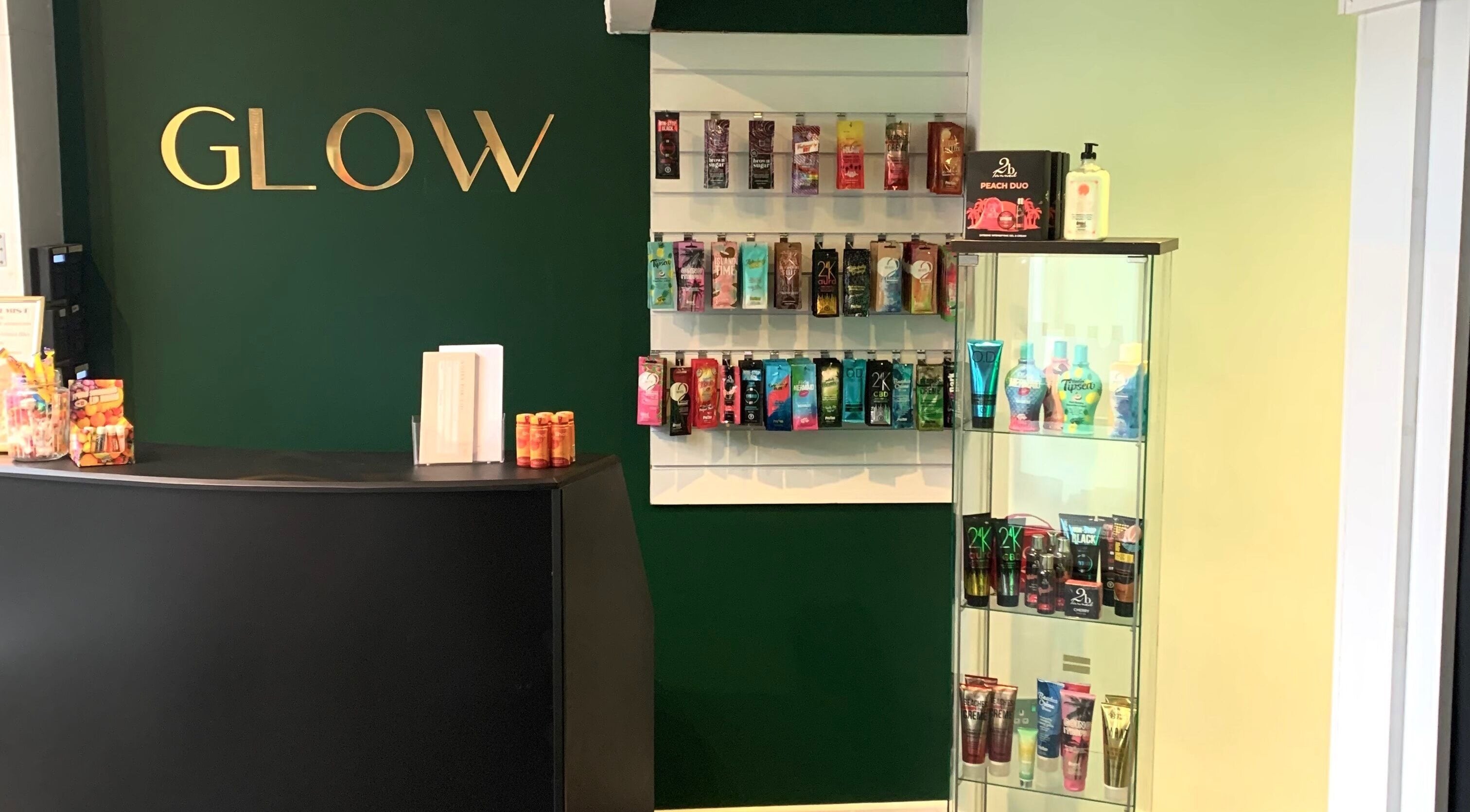 Welcome area at Glow Tanning and Beauty, Chelmsford, England, GB, showcasing tanning products.