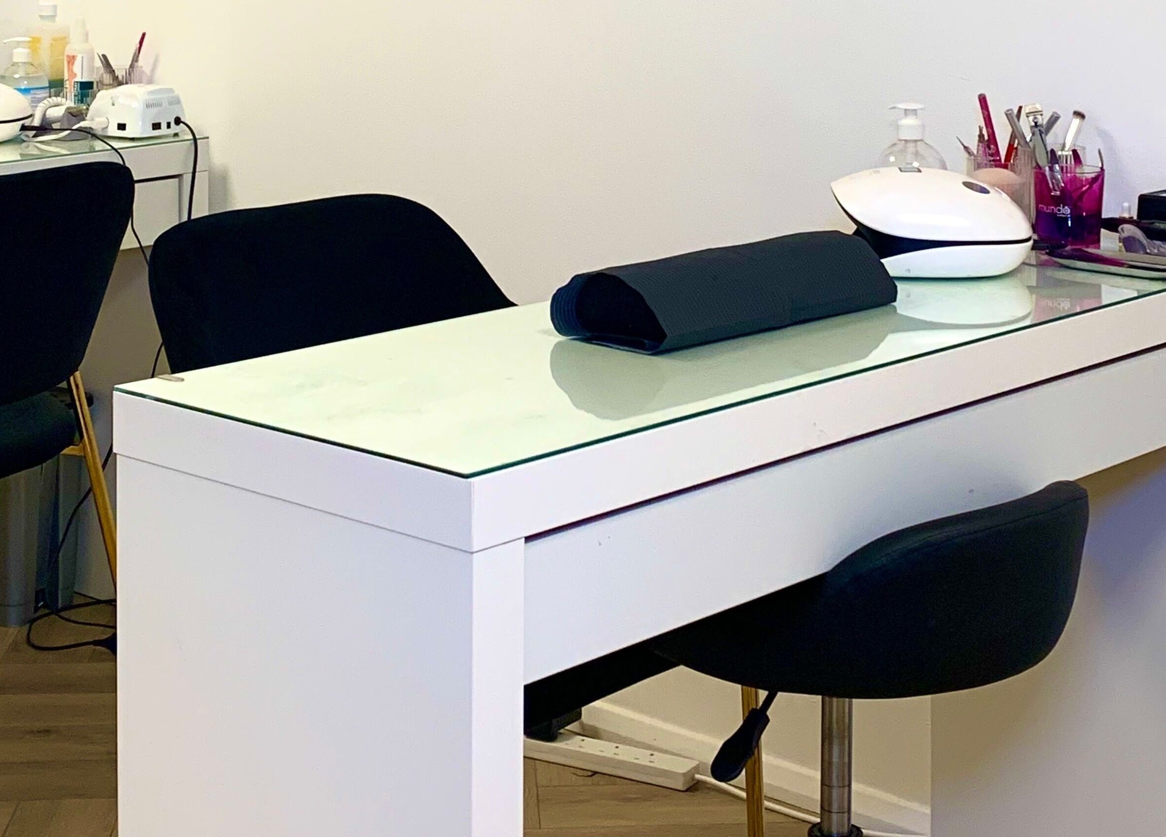 Modern nail station at Glow Tanning and Beauty in Chelmsford, England, GB offering premium nail care.