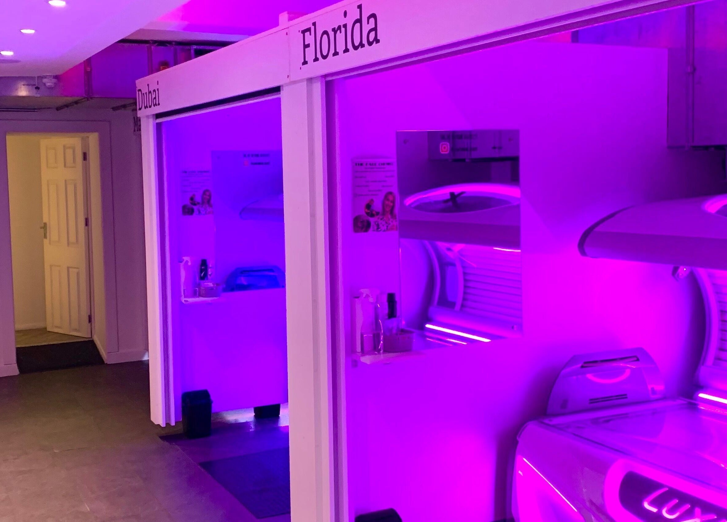Modern tanning beds with vibrant lighting at Glow Tanning and Beauty, Chelmsford, England, GB.