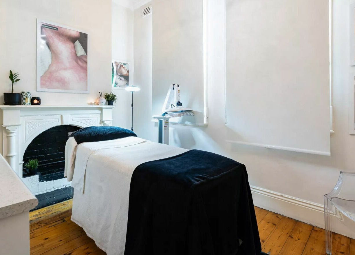 Treatment room at Universal Advanced Skin and Body Clinic in Melbourne, Victoria, AU with bed and soothing decor.