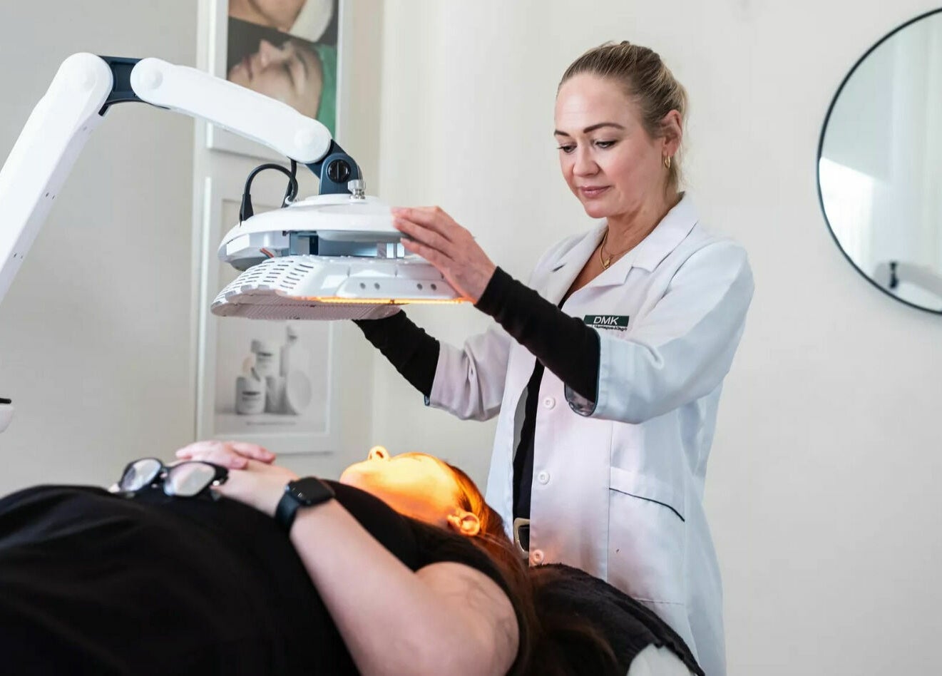 Aesthetician performing light therapy at Universal Advanced Skin and Body Clinic, Melbourne, Victoria, AU.