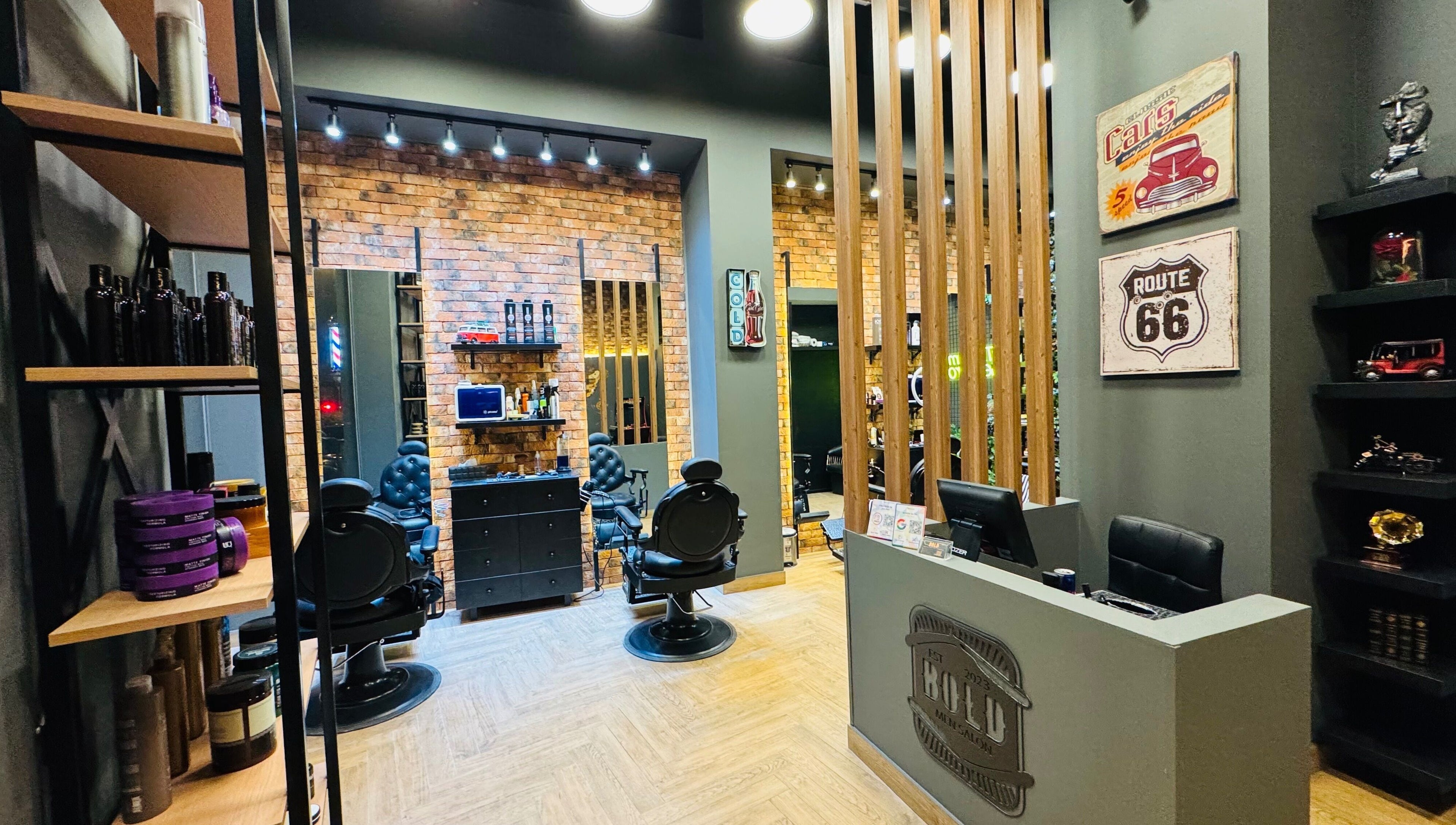 Interior of BOLD Men’s Salon in Dubai, featuring vintage decor and modern barber chairs.