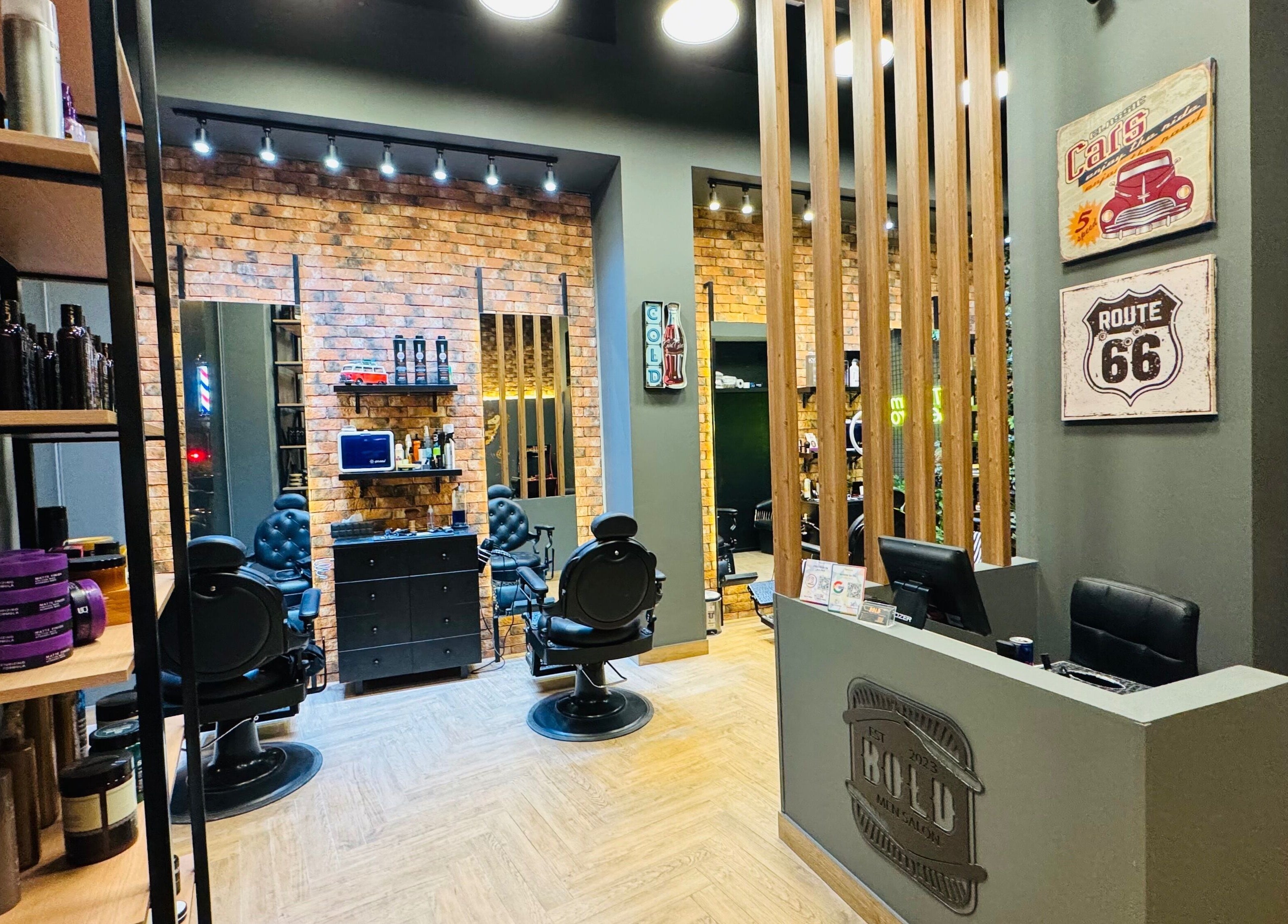 Interior of BOLD Men’s Salon in Dubai, featuring vintage decor and modern barber chairs.