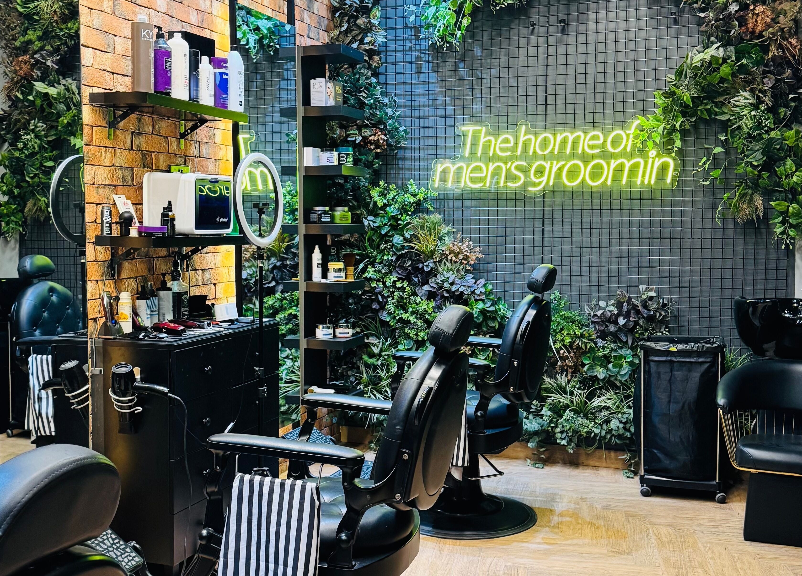 Stylish interior of BOLD Men’s Salon with sleek barber chairs and plants in Dubai, Dubai, AE.