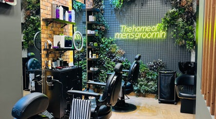 Stylish interior of BOLD Men’s Salon with sleek barber chairs and plants in Dubai, Dubai, AE.