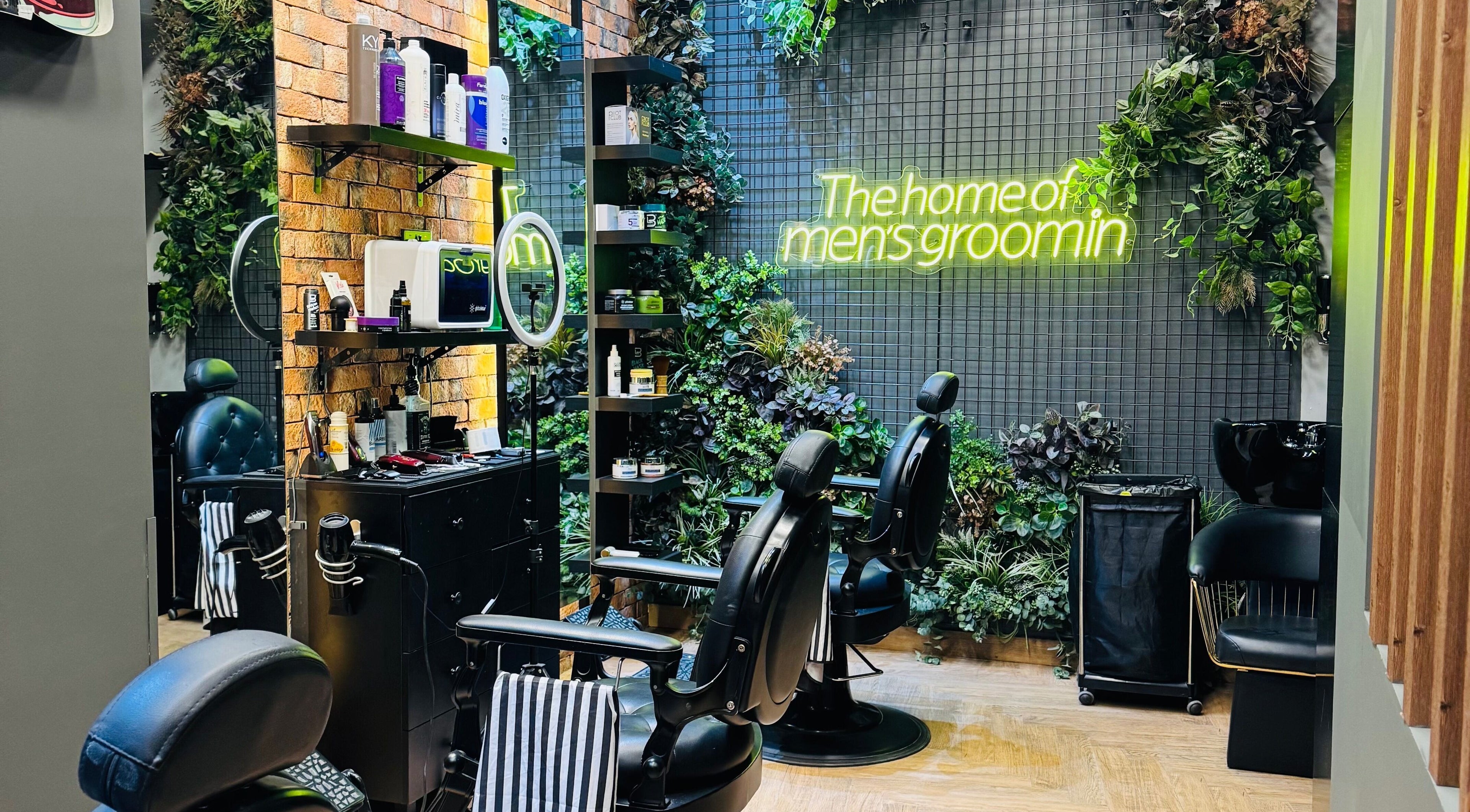 Stylish interior of BOLD Men’s Salon with sleek barber chairs and plants in Dubai, Dubai, AE.
