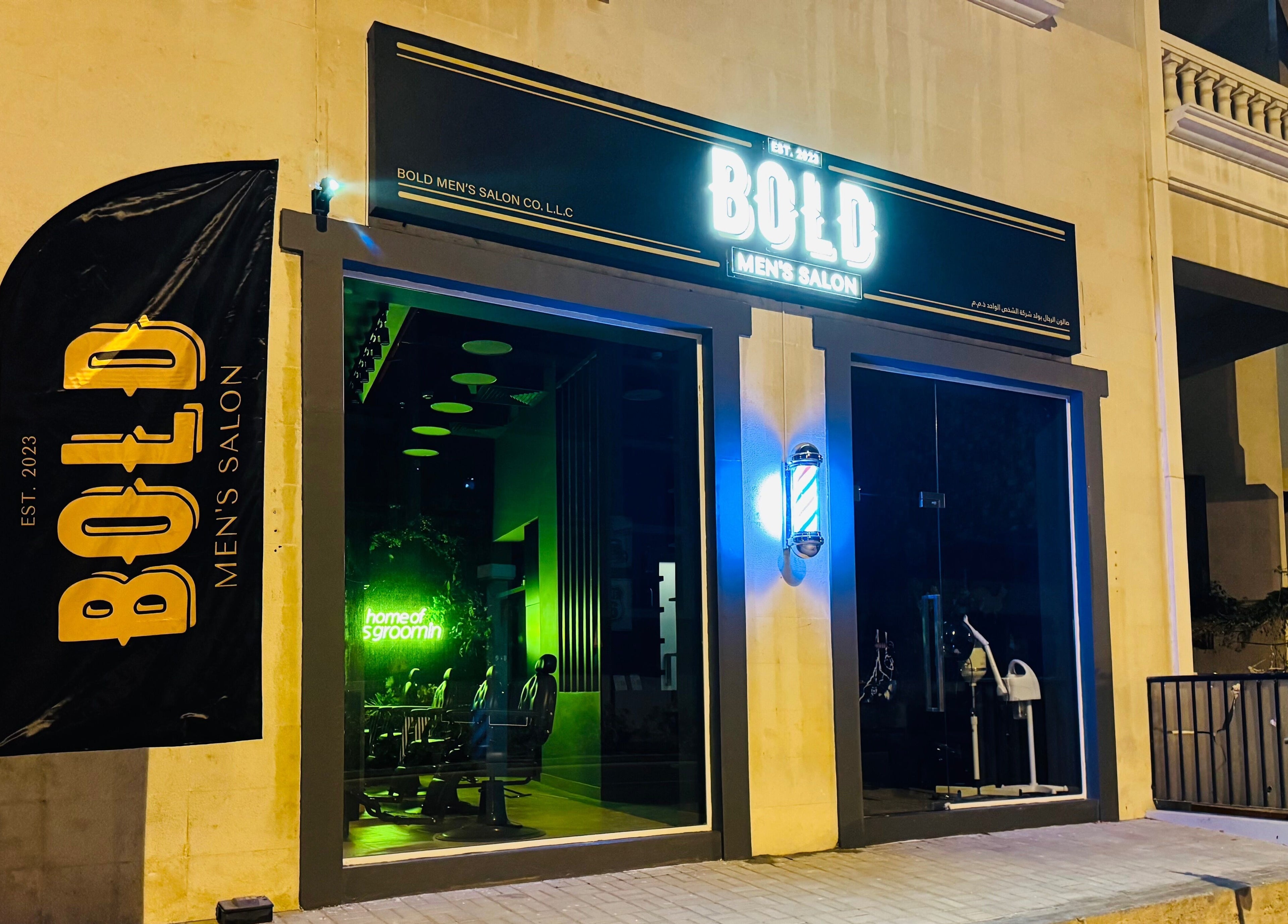 Exterior of BOLD Men’s Salon in Dubai, Dubai, AE lit at night showcasing stylish facade.